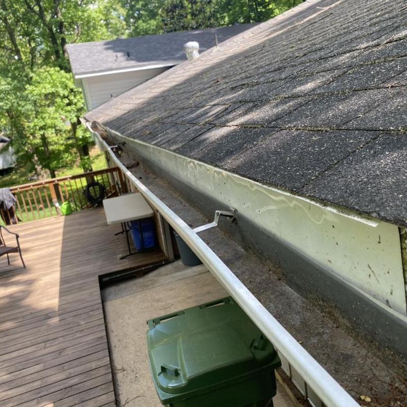 Gutter system with loose hangers and roof shingles