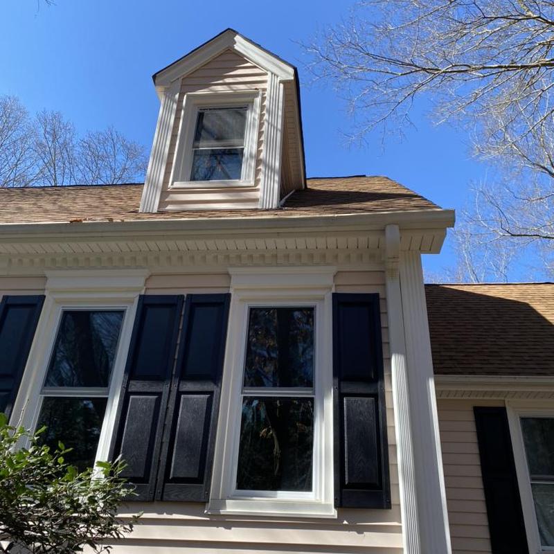 Step flashing behind siding on residential roof