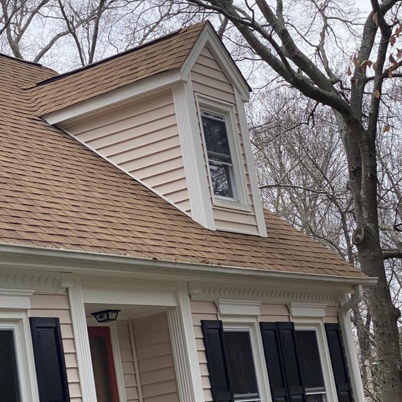 Step flashing behind siding on roof dormer repair