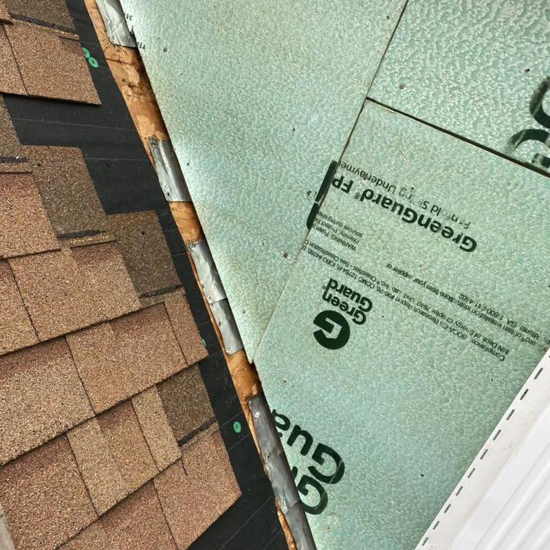 Step flashing behind removed siding on roof edge