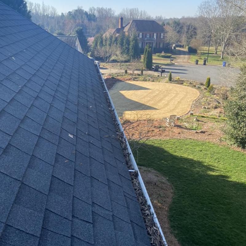 Roof shingles and gutter inspection after storm damage