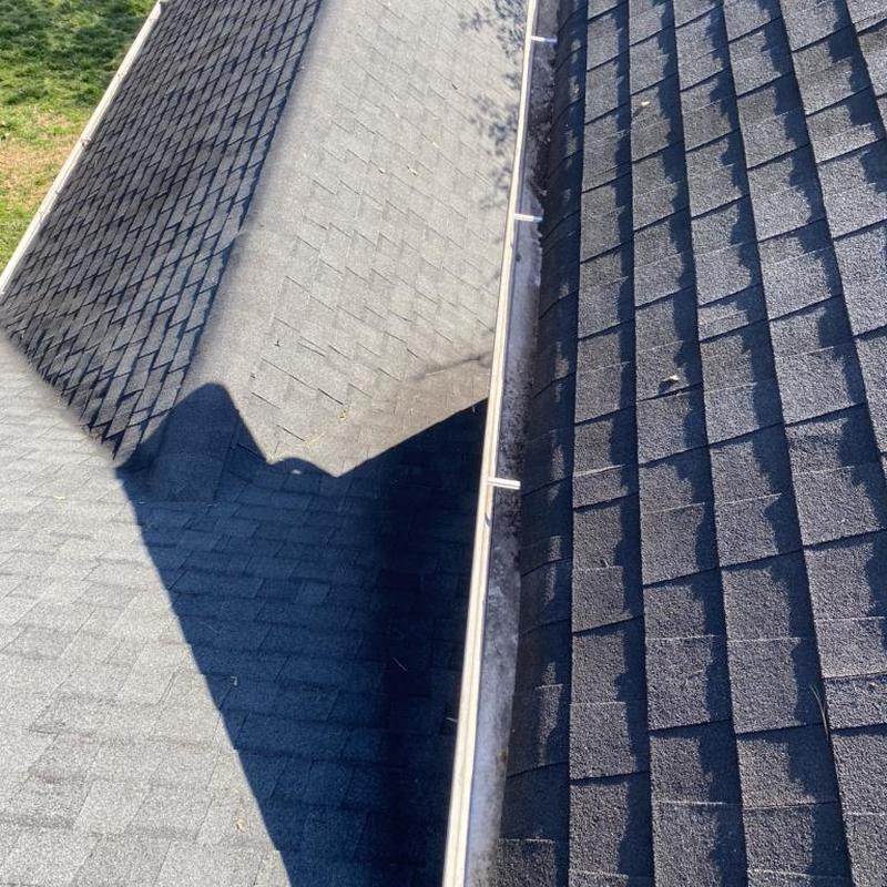 Asphalt shingle roof and gutter inspection after storm damage