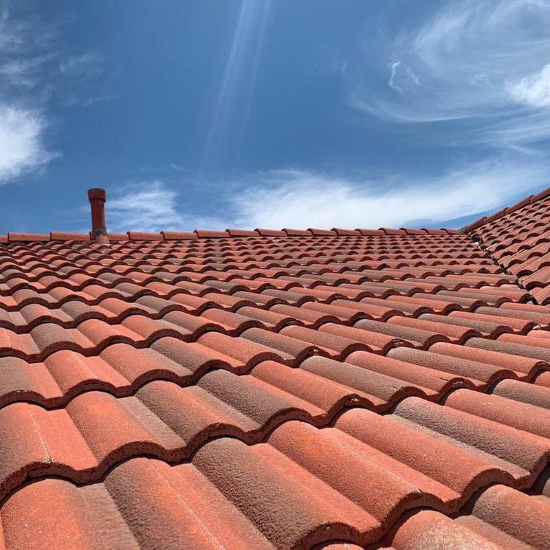 Tile roof under clear sky with ventilation pipe Tile roof under clear sky with ventilation pipe