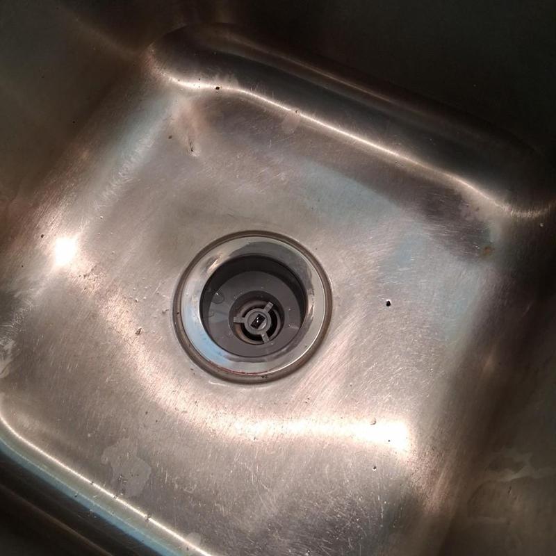 Kitchen sink drain and plumbing under sink