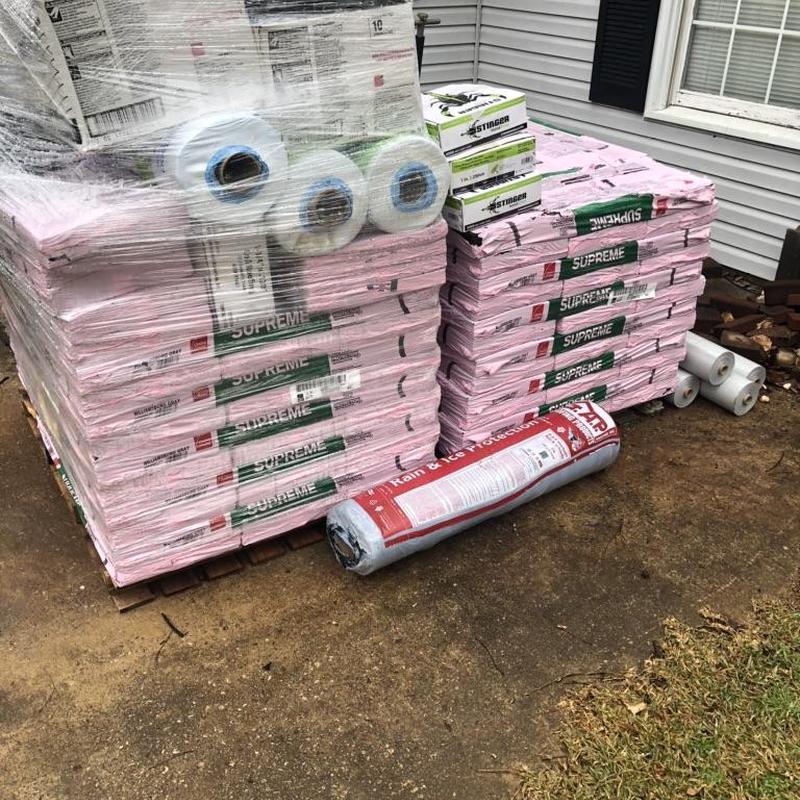 Owens Corning Supreme Roofing Shingles stacked outdoors