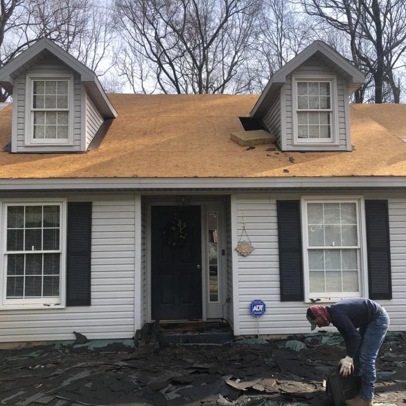 Roof decking replacement with shingle removal in progress