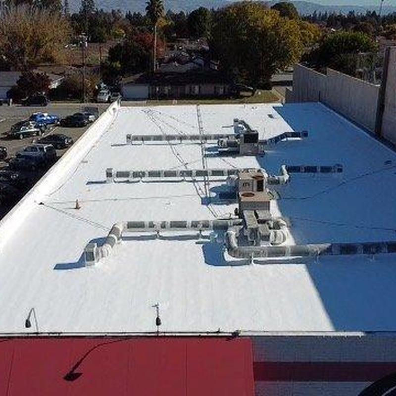 Commercial flat roof with HVAC system and ductwork Commercial flat roof with HVAC system and ductwork
