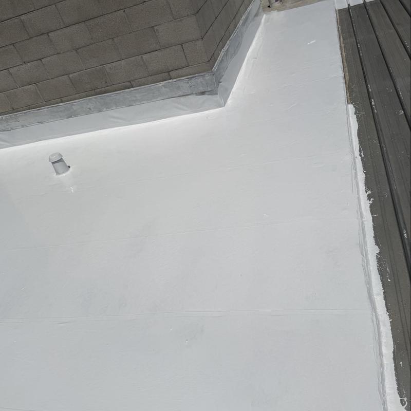 Flat roof silicone coating with sealed edges Flat roof silicone coating with sealed edges