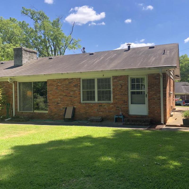 Asphalt shingle roof with wind and hail damage