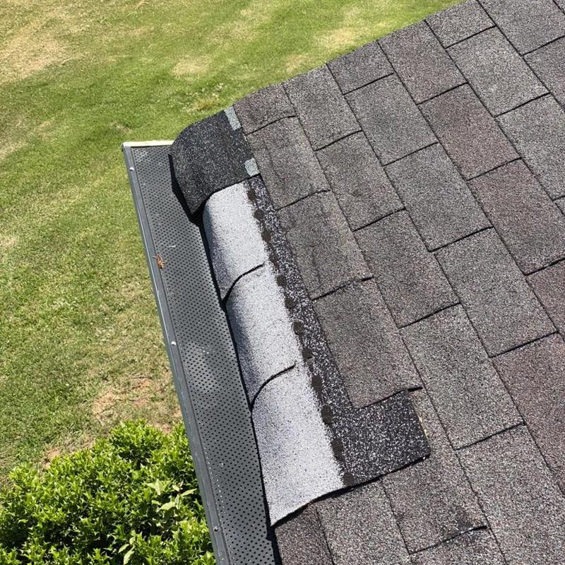 Architectural shingle roof with wind and hail damage