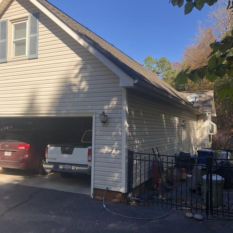 Asphalt shingle roof on residential garage and home