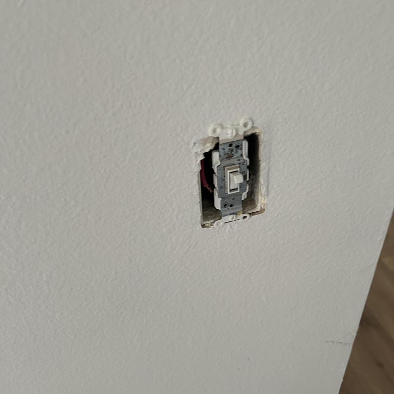 Light switch missing cover plate on drywall wall Light switch missing cover plate on drywall wall