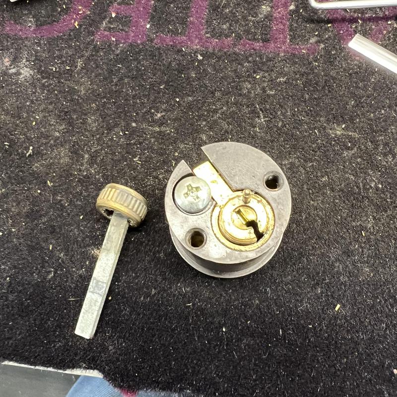 Emtek lock cylinder with key tailpiece on mat