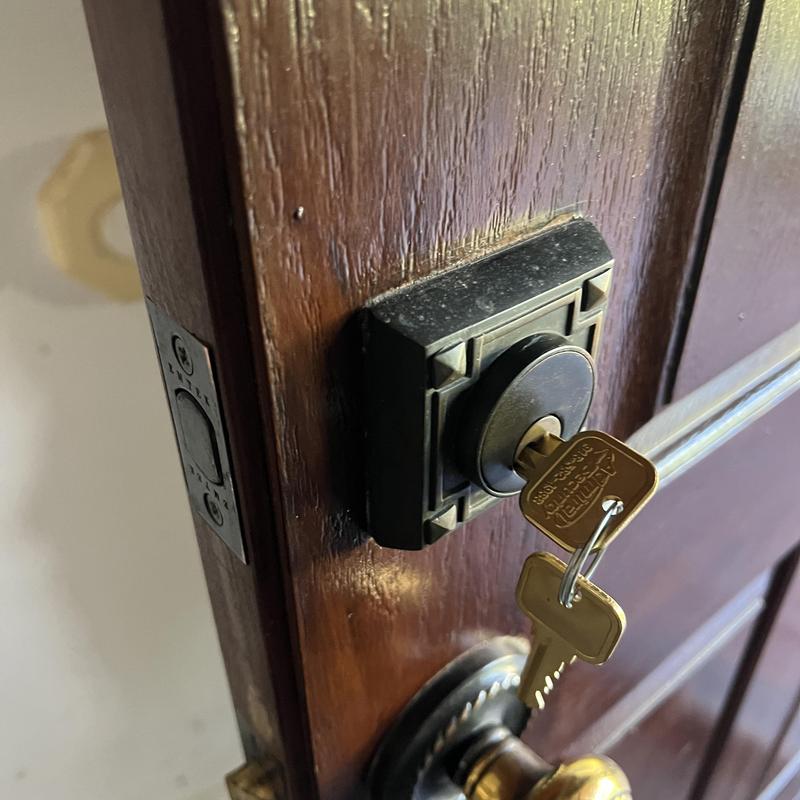 Emtek handle set with key in wood door lock