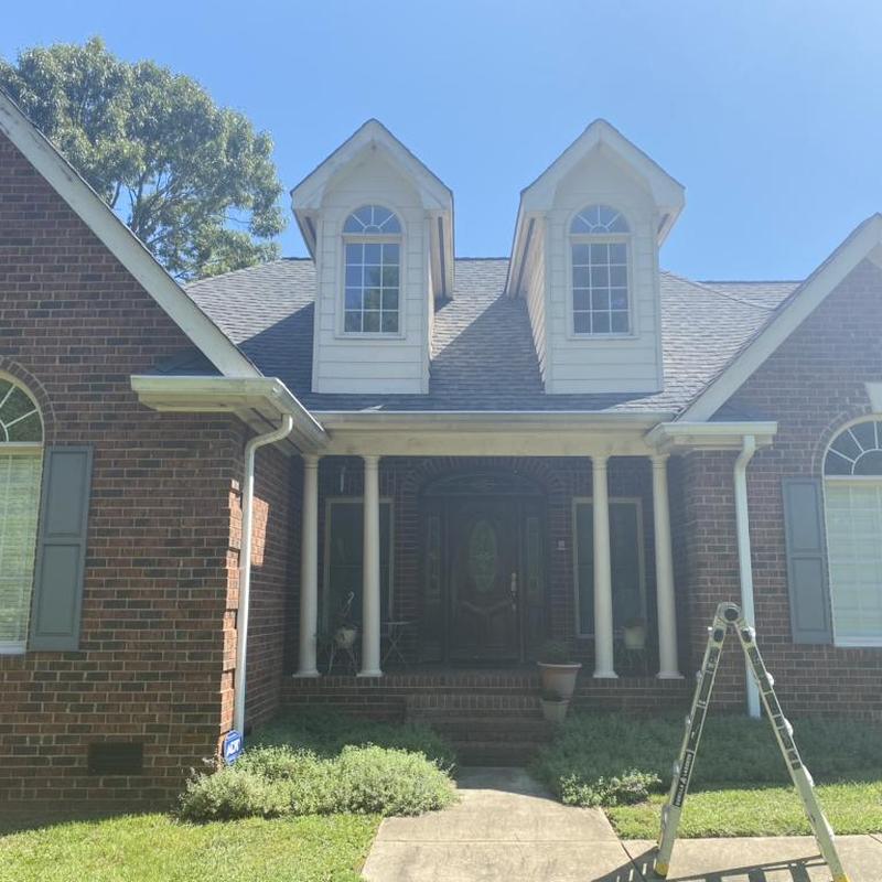 Asphalt shingle roof with hail and wind damage inspection