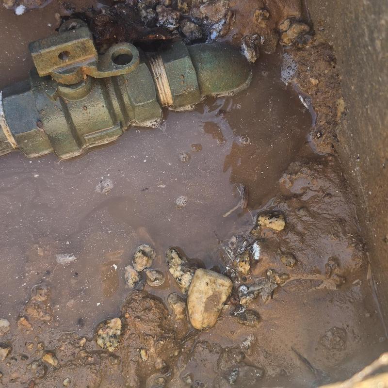 Water valve with muddy water and soil buildup