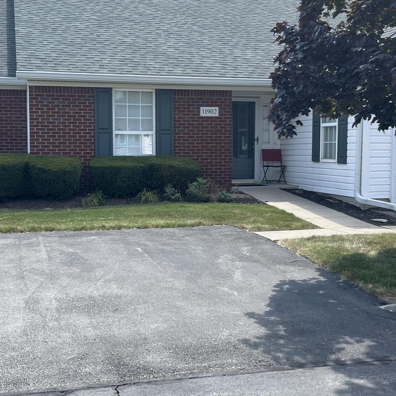 Asphalt driveway with front lawn and walkway Asphalt driveway with front lawn and walkway