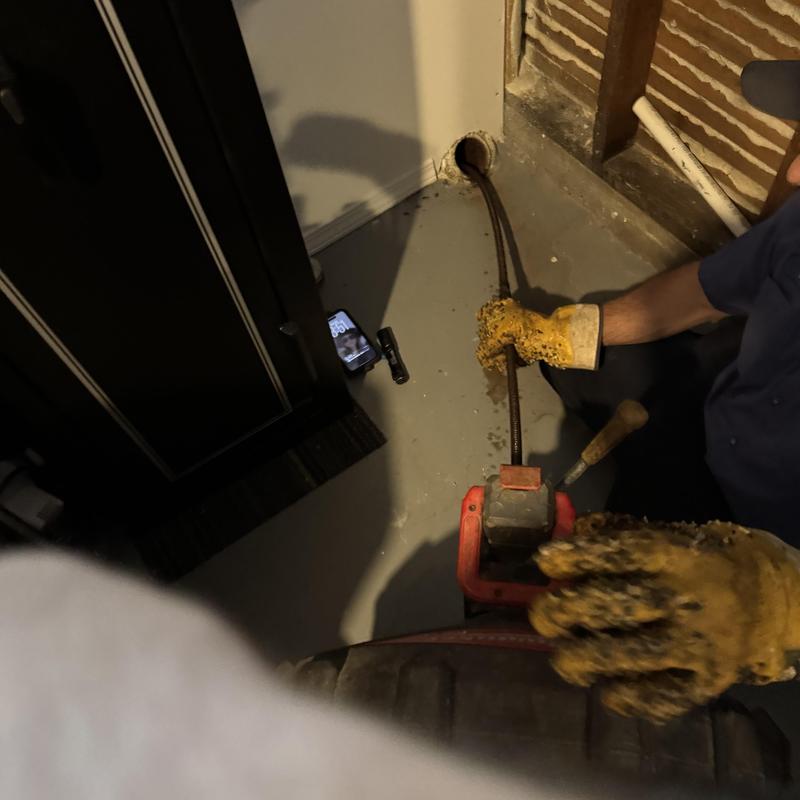 Basement sewer cleanout with drain snake and root removal Basement sewer cleanout with drain snake and root removal