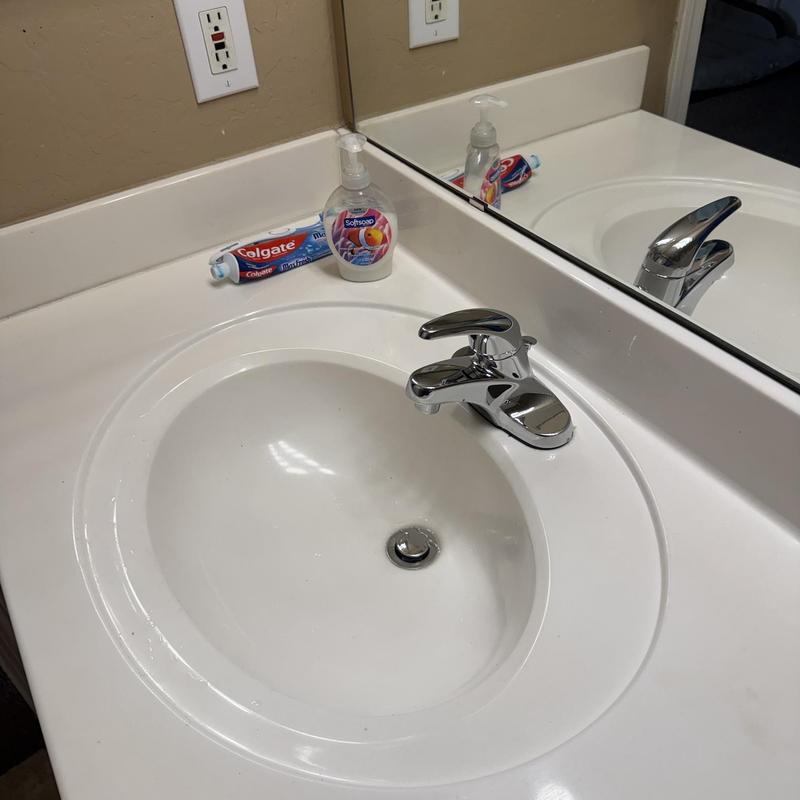 Lavatory faucet and sink with soap and toothpaste