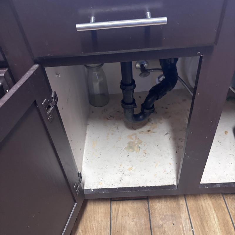P-trap drain assembly under kitchen sink cleaning