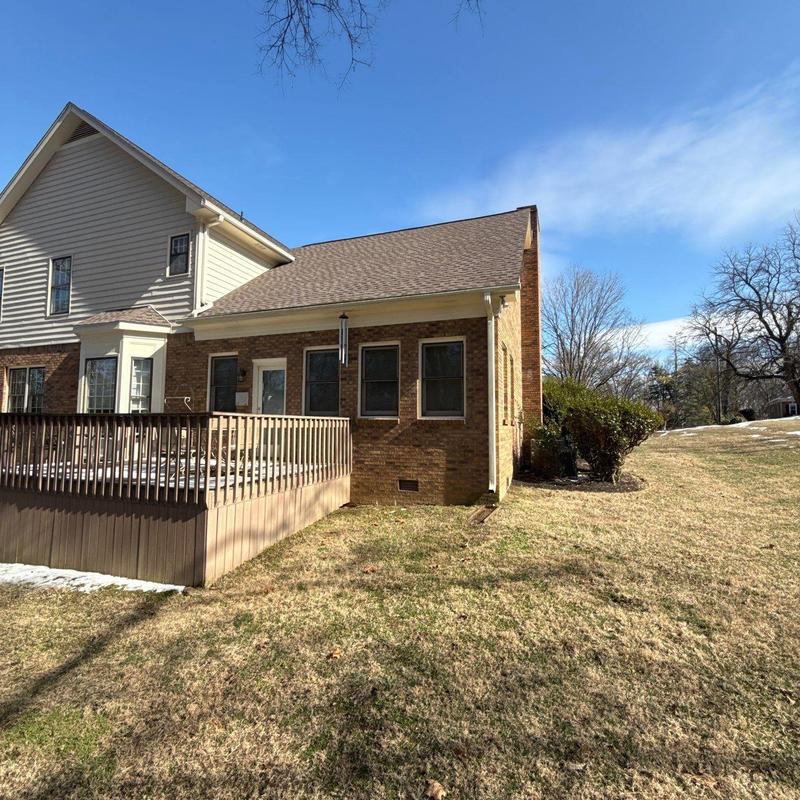 Roof shingles and flashing with hail damage on house