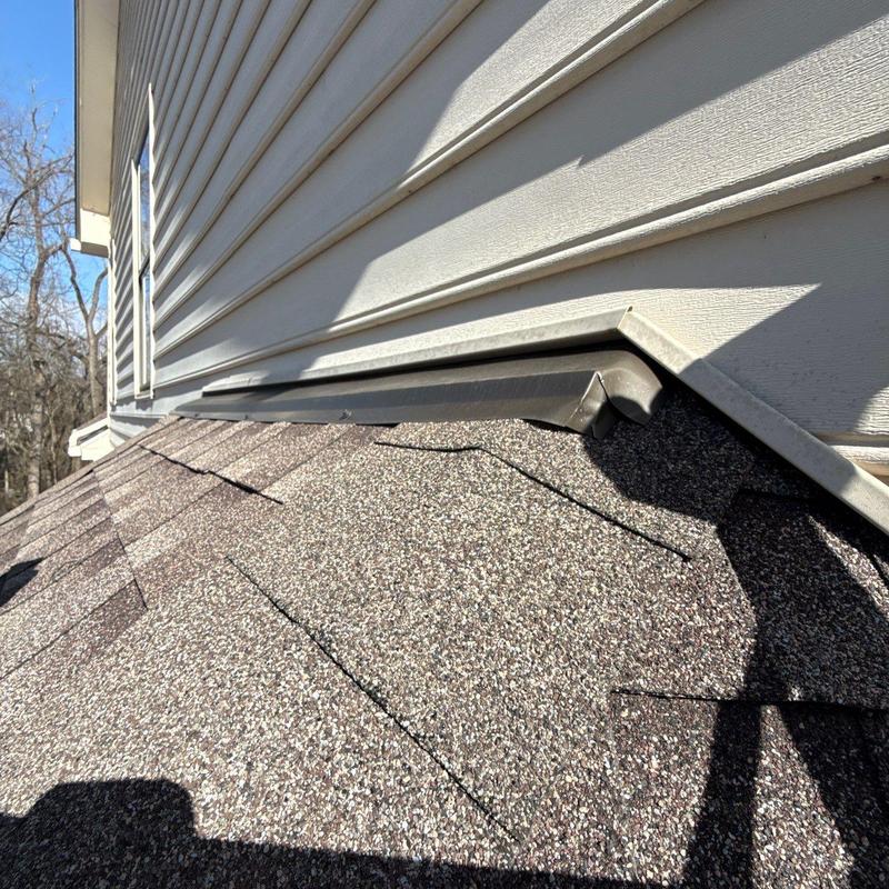 Roof flashing and shingles with hail damage inspection