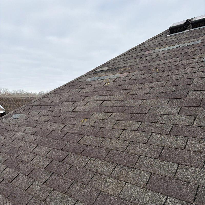 Asphalt shingles on roof with hail damage markings
