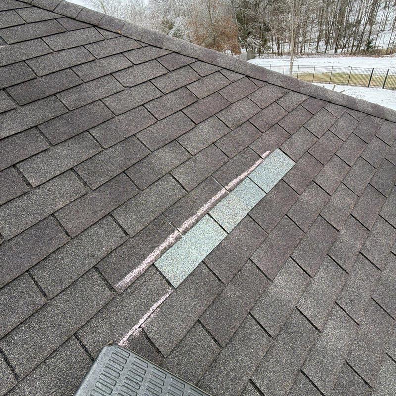 Asphalt roof shingles with hail damage markings