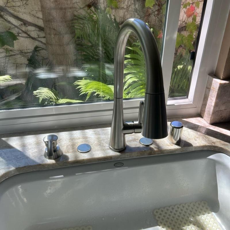 Kitchen faucet with sprayer installed by window