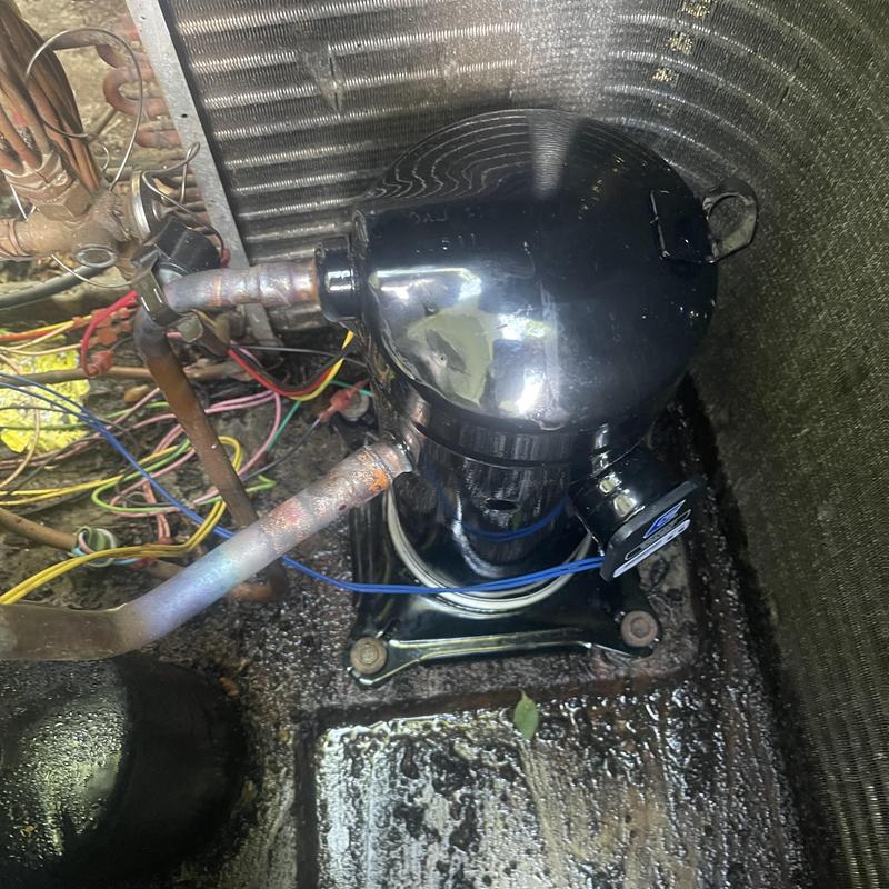 Package unit compressor with wiring and pipes