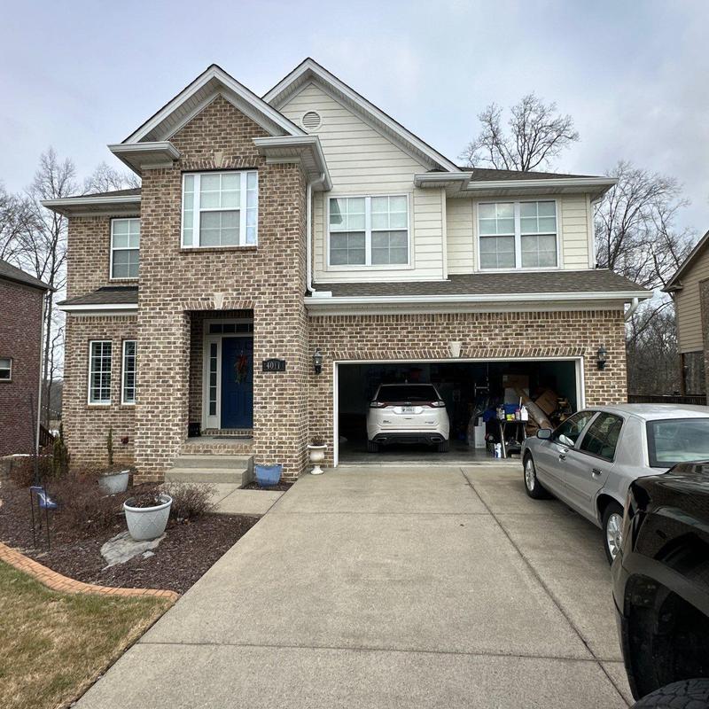 Roof shingles with hail damage on residential home