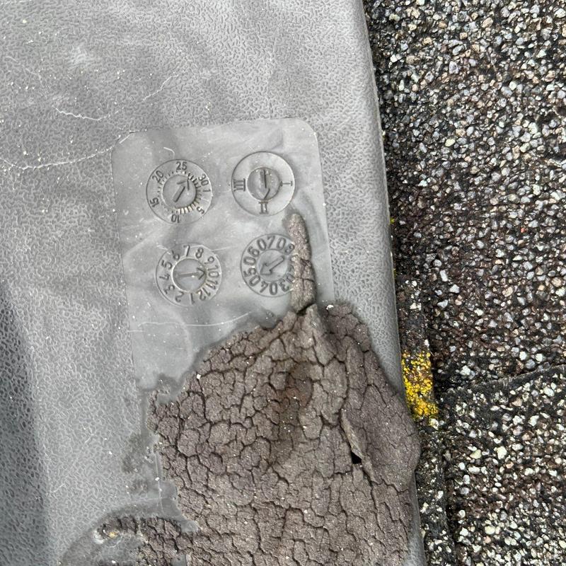 Rubber roof membrane cracked and weathered near controls