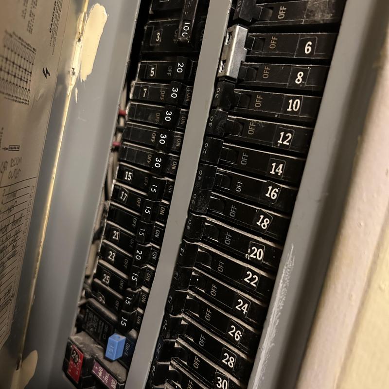 Electrical breaker panel with labeled switches off and on Electrical breaker panel with labeled switches off and on