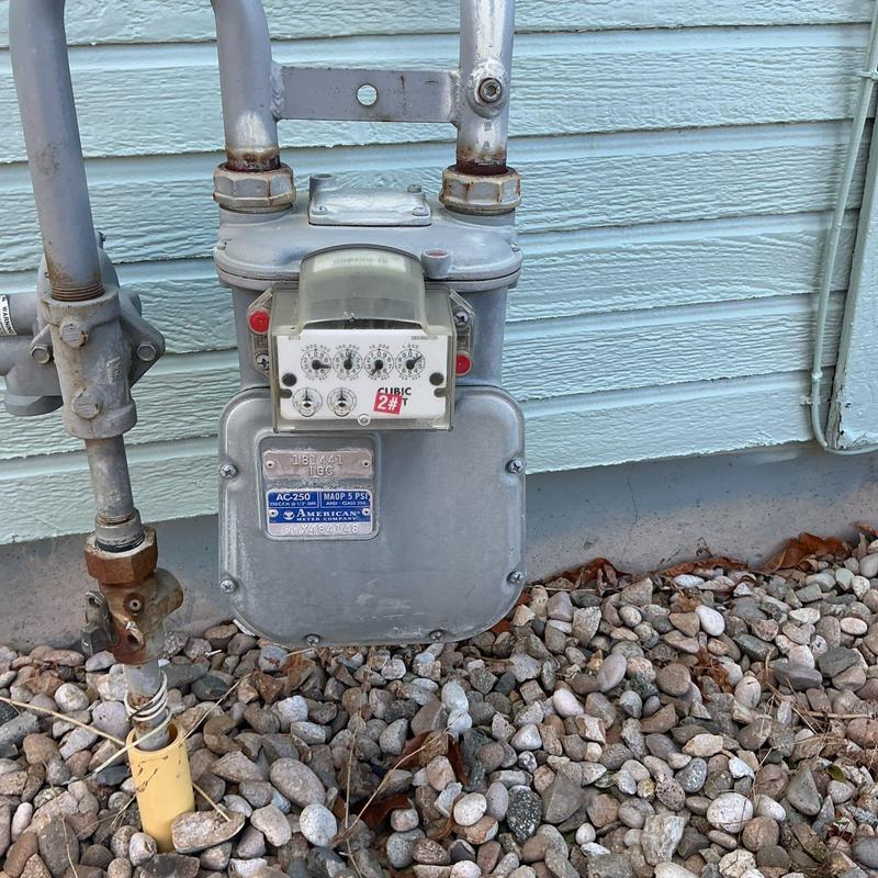 Gas meter with attached piping and shutoff valve Gas meter with attached piping and shutoff valve