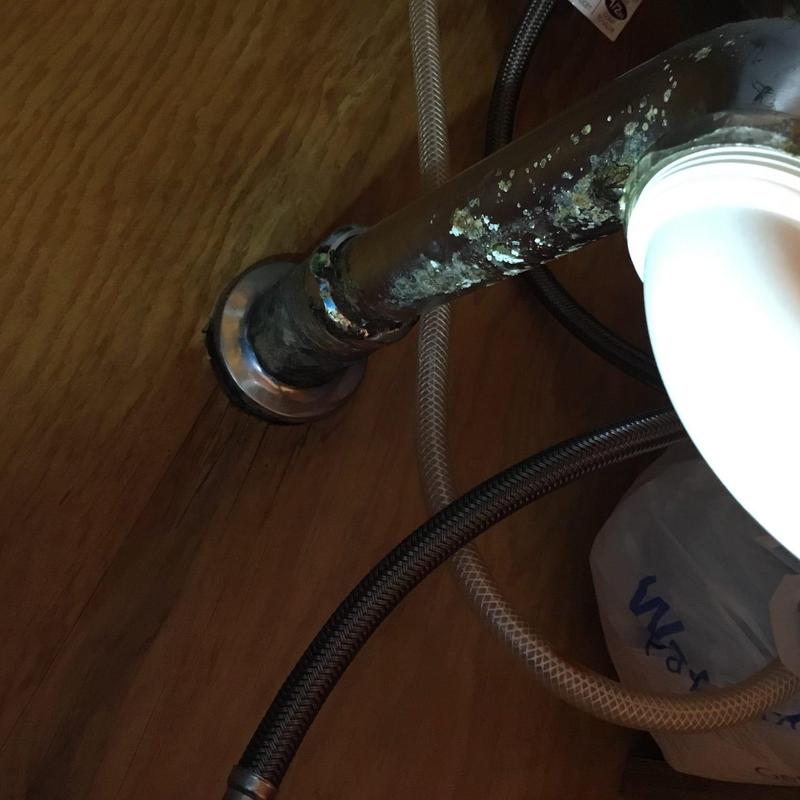 Kitchen sink outlet pipe with corrosion buildup Kitchen sink outlet pipe with corrosion buildup