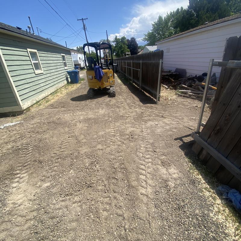 Building sewer trench with excavator in residential alley Building sewer trench with excavator in residential alley