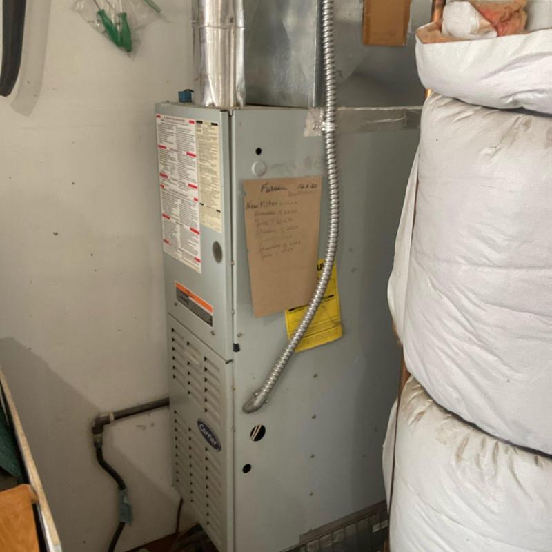 Furnace unit with maintenance notes and ductwork Furnace unit with maintenance notes and ductwork