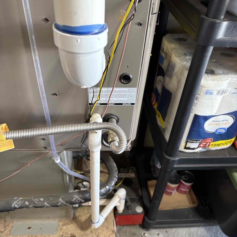 Furnace condensate drain and gas line connections Furnace condensate drain and gas line connections