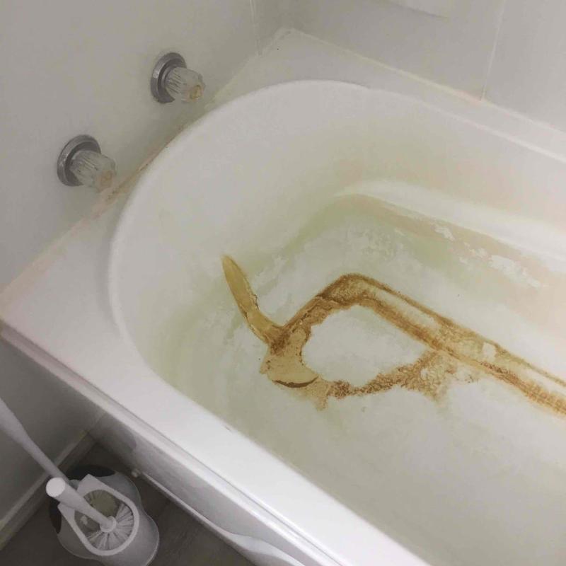 Walk-in tub with severe staining and two-handle valve
