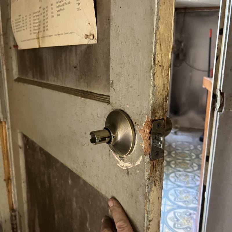 Door knob lock without key cylinder on weathered door
