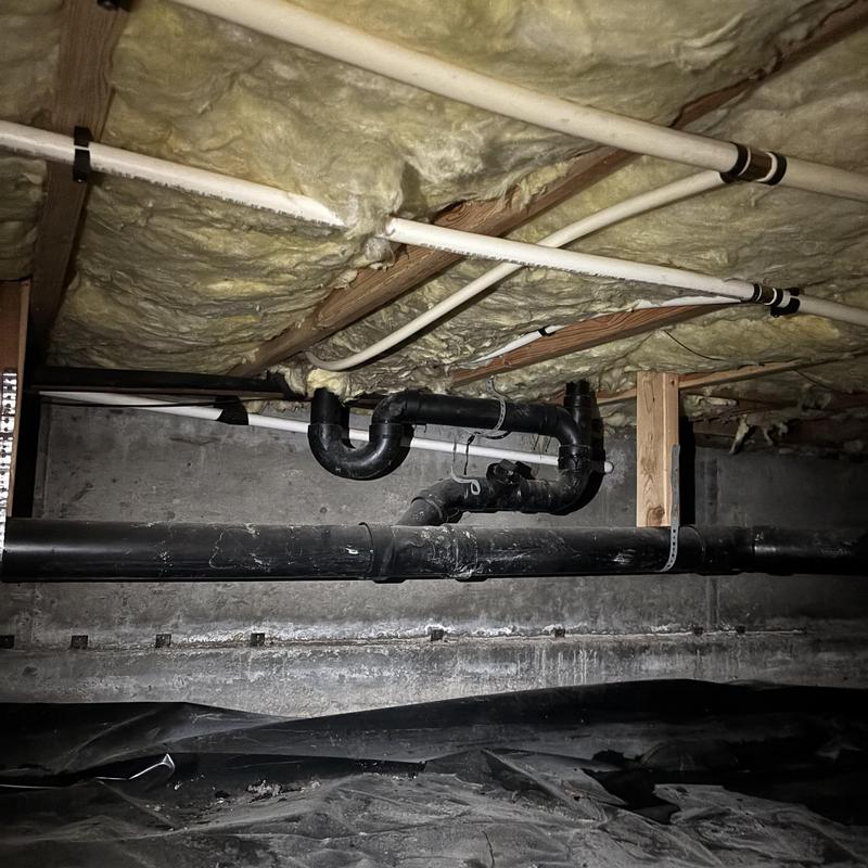 Black ABS drain piping in crawl space ceiling Black ABS drain piping in crawl space ceiling