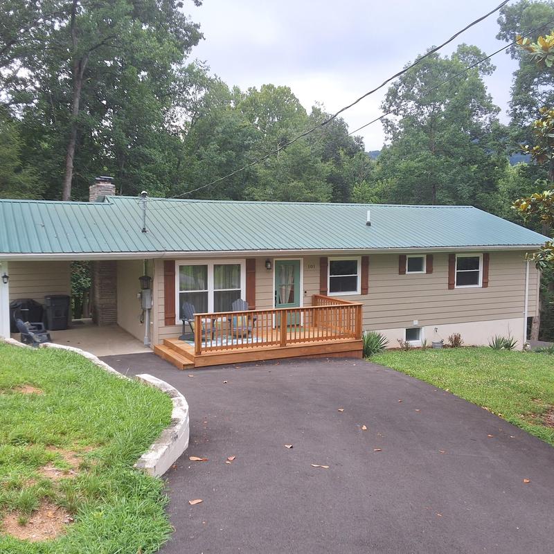 Metal roof with original shingles on residential home
