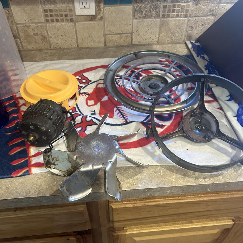 Kitchen exhaust fan parts removed on countertop Kitchen exhaust fan parts removed on countertop