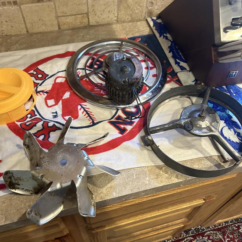 1950s kitchen exhaust fan parts disassembled on counter 1950s kitchen exhaust fan parts disassembled on counter