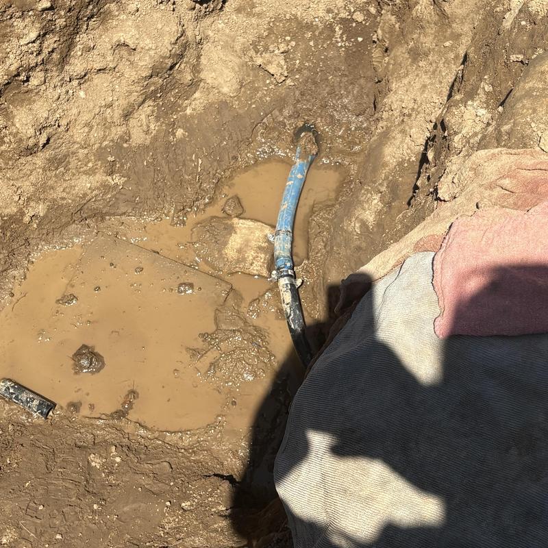 Polybutylene water service pipe replacement in muddy trench Polybutylene water service pipe replacement in muddy trench