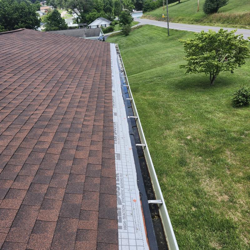 Asphalt shingle carport roof with gutter installation