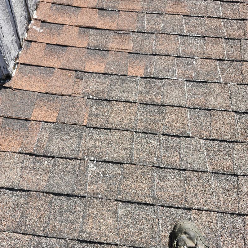 Asphalt roof shingles inspection with chalk markings
