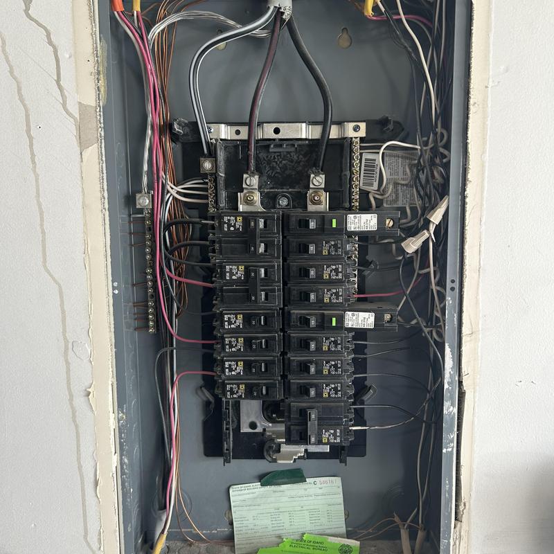 Electrical breaker panel with multiple circuit breakers and wiring Electrical breaker panel with multiple circuit breakers and wiring