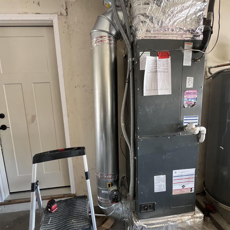 HVAC furnace with ductwork and ladder in utility room HVAC furnace with ductwork and ladder in utility room