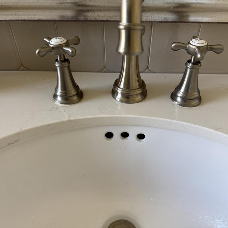 Bathroom sink faucet with hot and cold handles